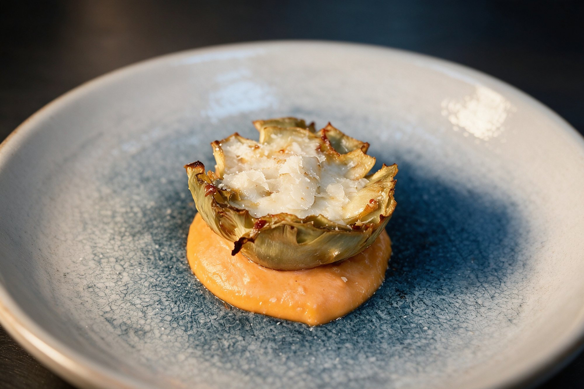 Alcachofas gratinadas de La Farola, con queso fundido sobre puré